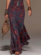 Lavinia | Abito maxi a sirena con scollo halter, pizzo e stampa floreale
